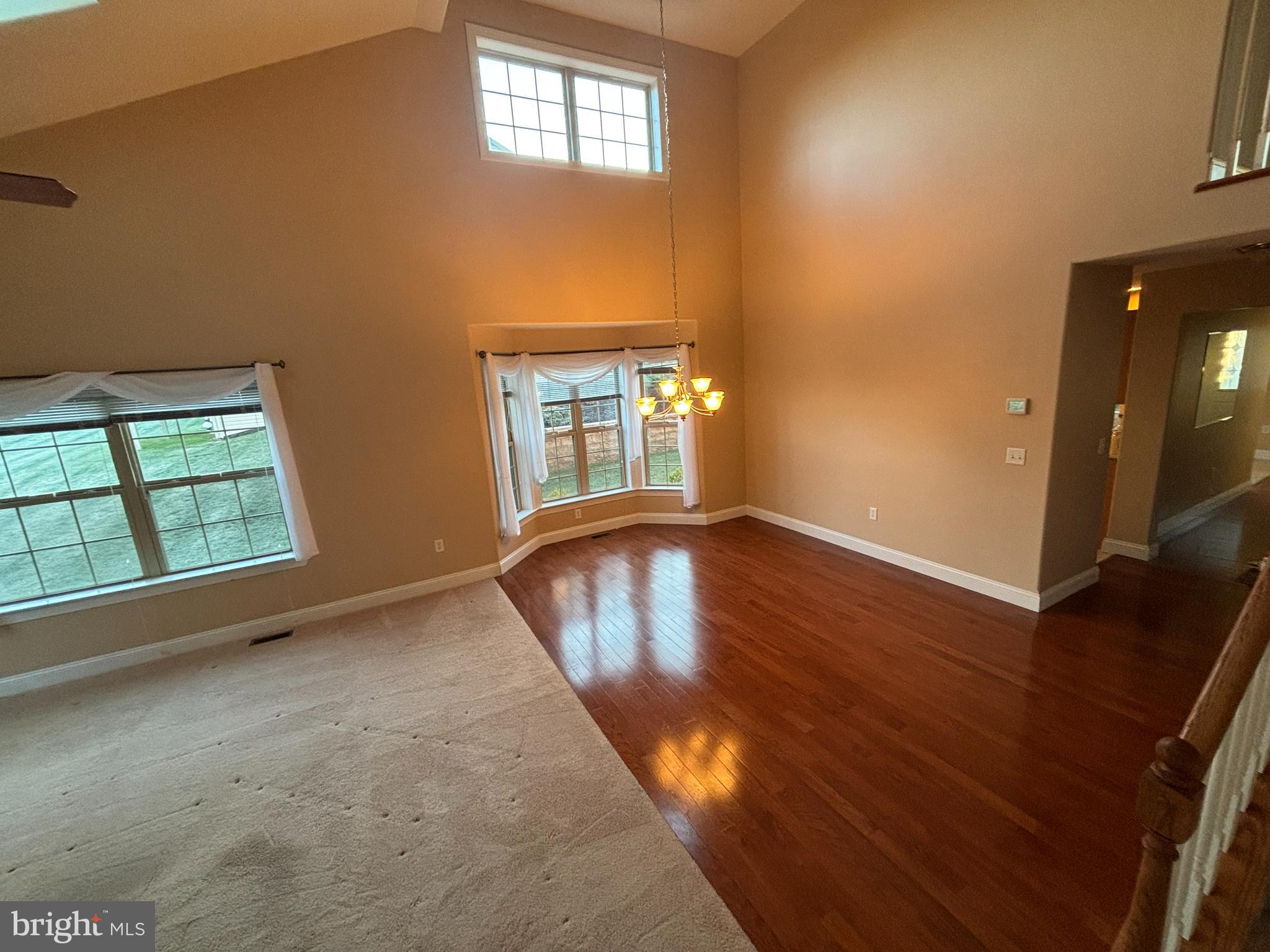 4300 North Victoria Way Harrisburg, PA 17112 - Photo 16 of 41 an empty room with wooden floor and windows