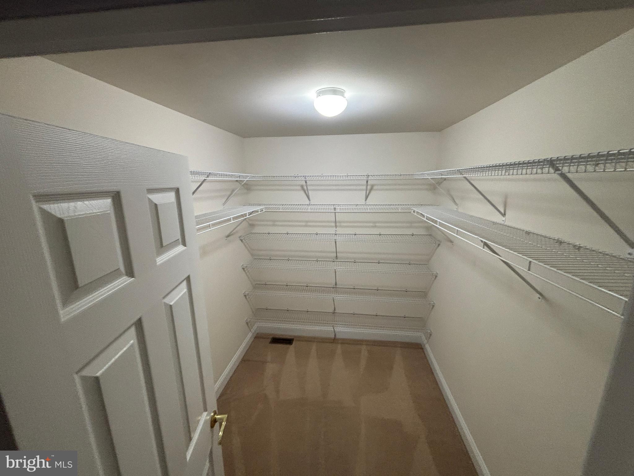 4300 North Victoria Way Harrisburg, PA 17112 - Photo 23 of 41 a view of storage and utility room with racks on the wall
