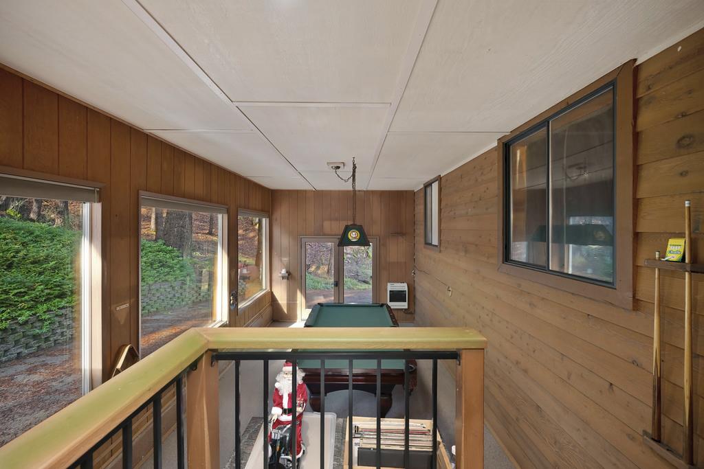 6301 Canyon Creek Road Georgetown, CA 95635 - Photo 29 of 87 a view of a balcony with furniture and wooden floor