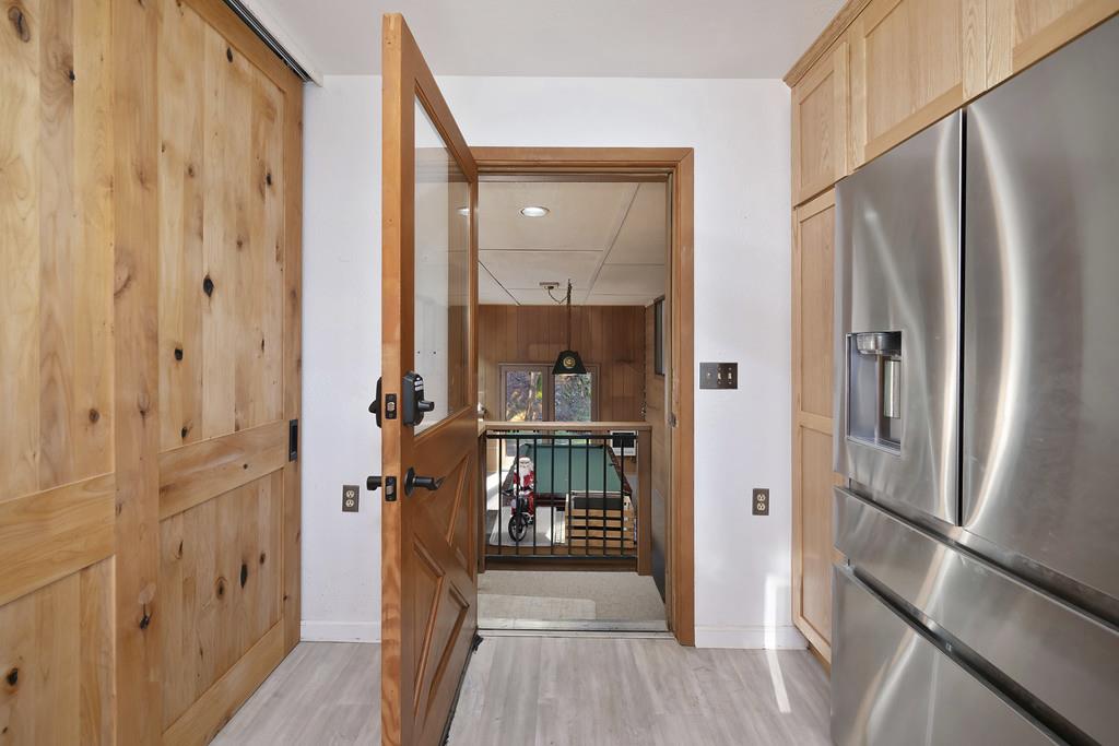 6301 Canyon Creek Road Georgetown, CA 95635 - Photo 32 of 87 a view of a hallway with wooden floor and staircase