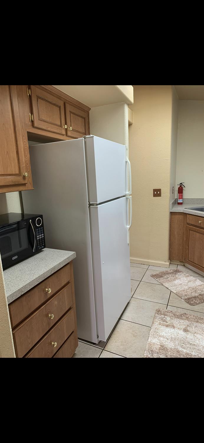 6301 Canyon Creek Road Georgetown, CA 95635 - Photo 84 of 87 a view of storage and utility room with refrigerator