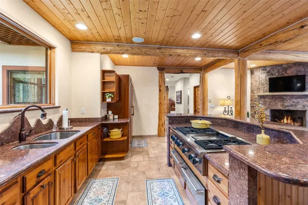 a kitchen with stainless steel appliances granite countertop a stove and a sink