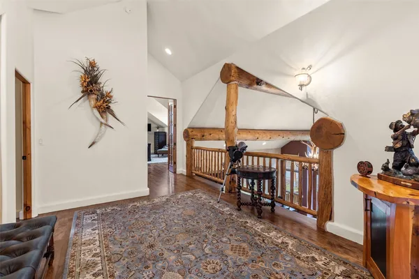 a view of an entryway with a table and chairs