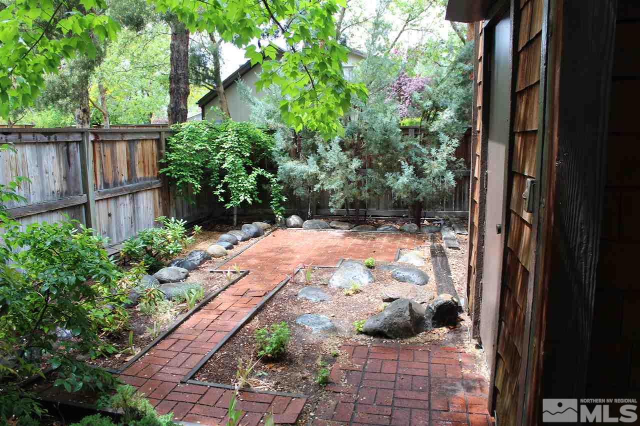 654 West Riverview Circle, Unit 654 Reno, NV 89509 - Photo 15 of 17 a view of a backyard with potted plants