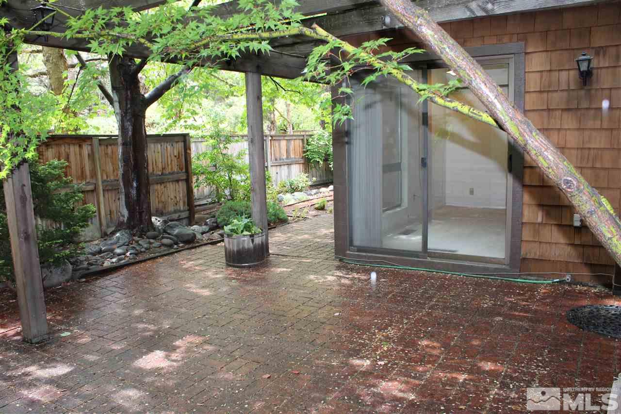 654 West Riverview Circle, Unit 654 Reno, NV 89509 - Photo 17 of 17 a backyard of a house with seating space