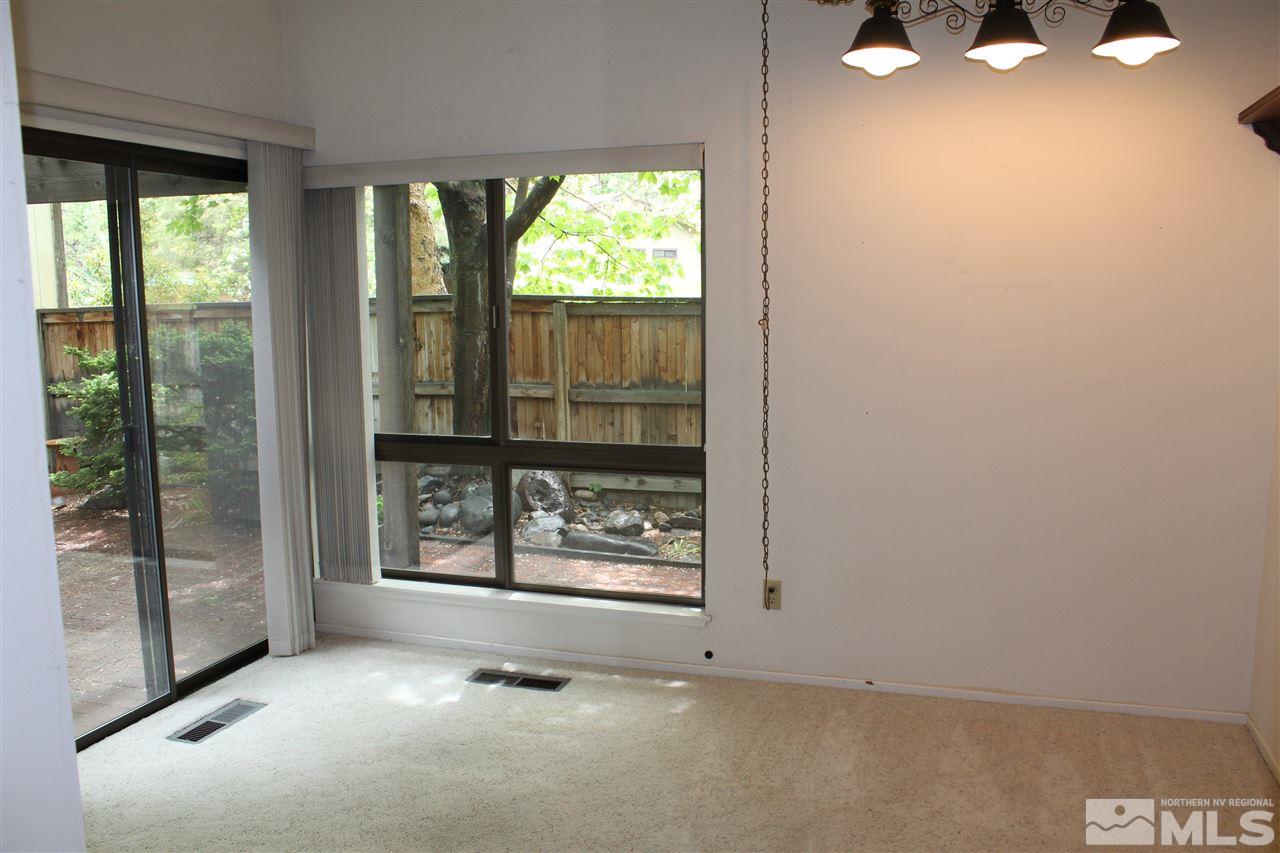 654 West Riverview Circle, Unit 654 Reno, NV 89509 - Photo 7 of 17 an empty room with windows