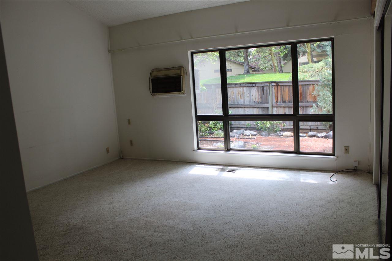 654 West Riverview Circle, Unit 654 Reno, NV 89509 - Photo 9 of 17 an empty room with windows