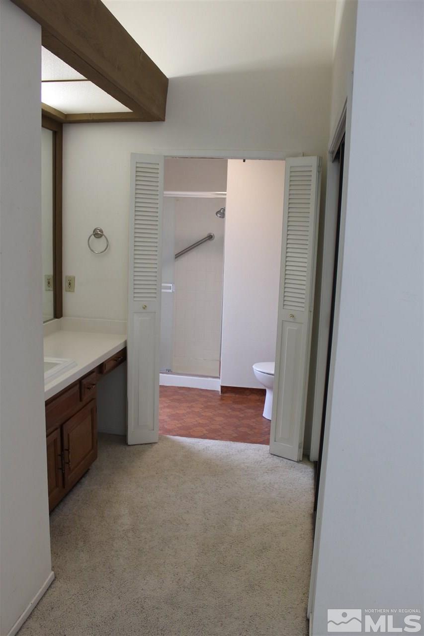654 West Riverview Circle, Unit 654 Reno, NV 89509 - Photo 10 of 17 a bathroom with a sink and a mirror