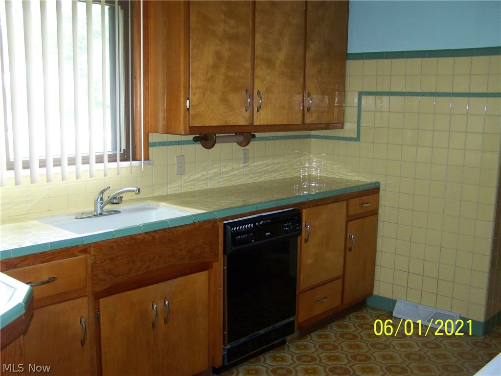 6838 Hilton Road Brecksville, OH 44141 - Photo 9 of 21 Another view of the kitchen with a large window overlooking the sink