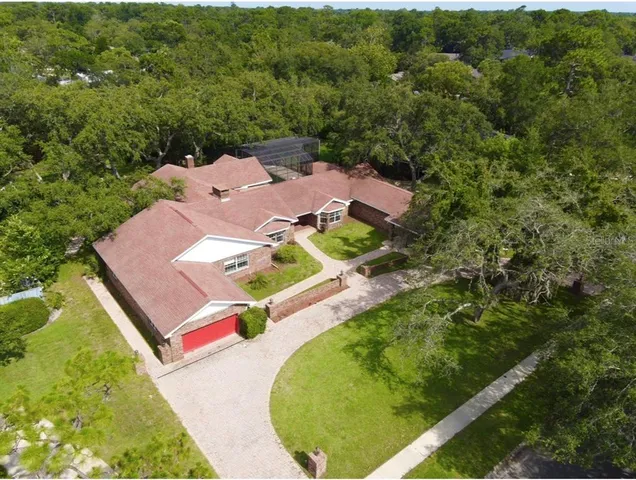 an aerial view of residential houses with outdoor space and street view