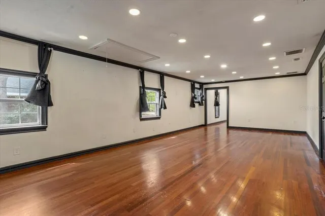 a bathroom with a granite countertop sink toilet and mirror