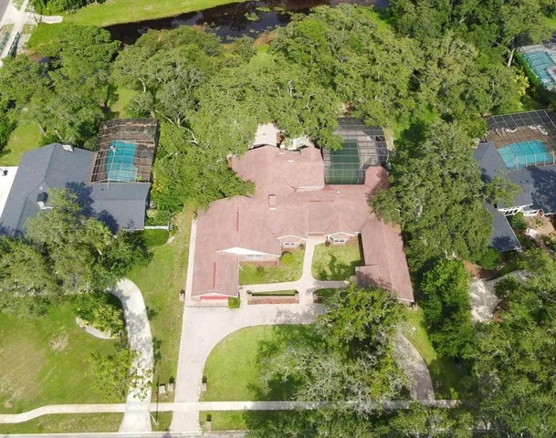 an aerial view of a house with garden space and sitting space