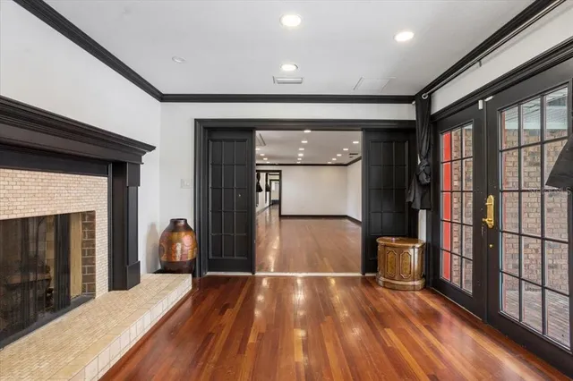 a large kitchen with kitchen island a large counter top stainless steel appliances and cabinets