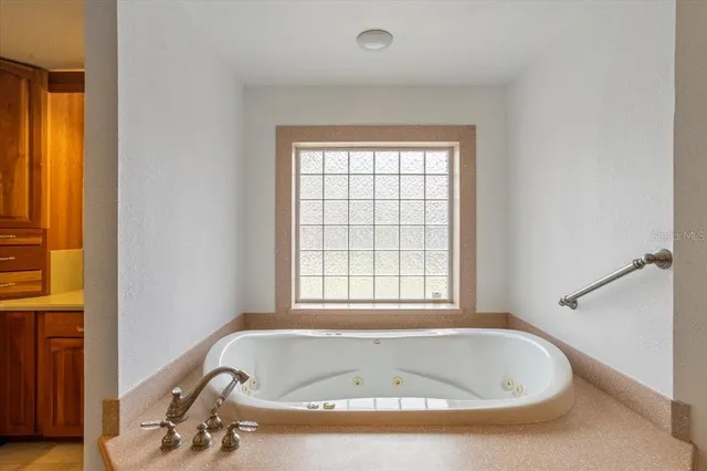 a room with a bed and a window