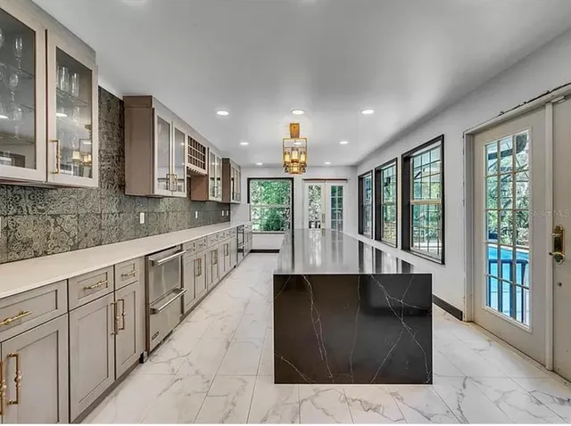 a view of swimming pool with a patio