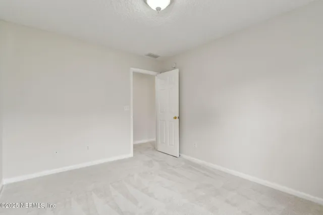 a bathroom with a sink toilet vanity and shower