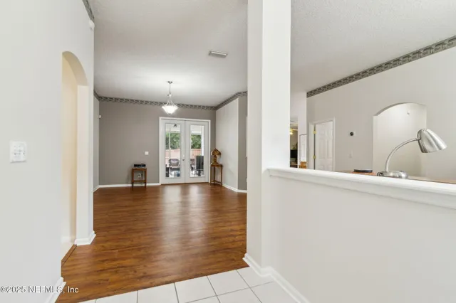 a view of a living room and chandelier