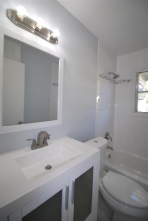 6918 Lockheed Avenue Dallas, TX 75209 - Photo 6 of 9 a bathroom with a sink toilet and shower