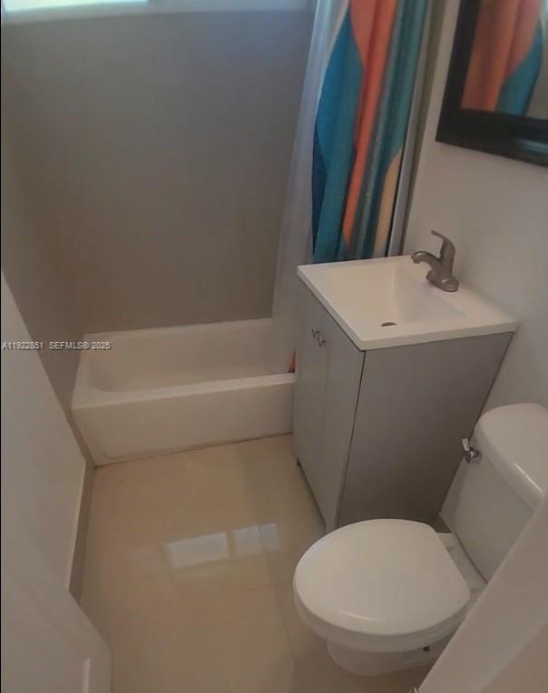 1050 98th Street, Unit 2W Bay Harbor Islands, FL 33154 - Photo 8 of 9 a bathroom with a toilet and a bathtub