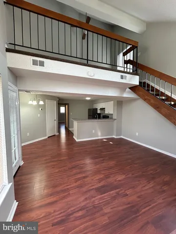 a view of entryway with wooden floor