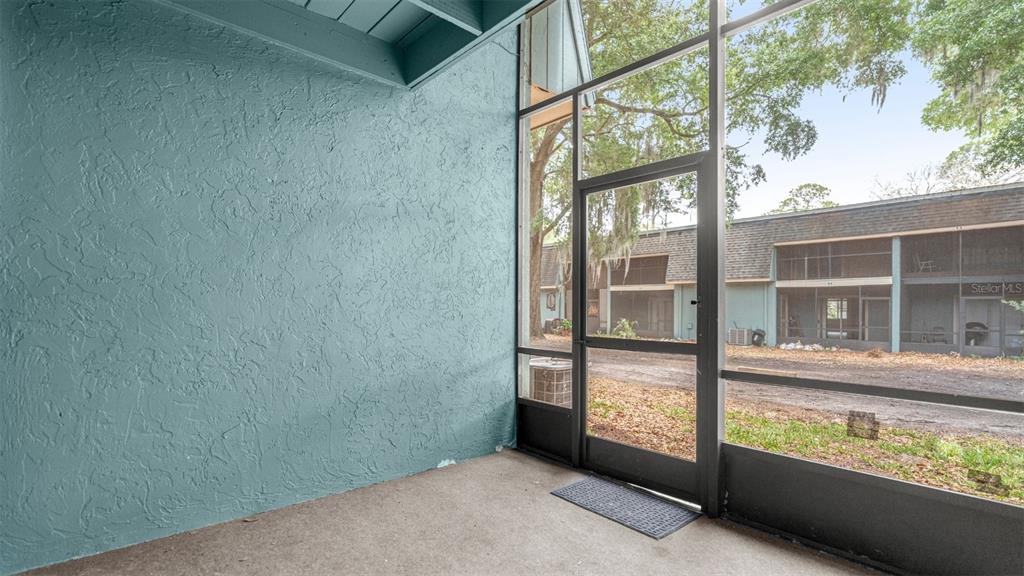 501 Southwest 75th Street, Unit B5 Gainesville, FL 32607 - Photo 33 of 38 a view of a glass door with a balcony