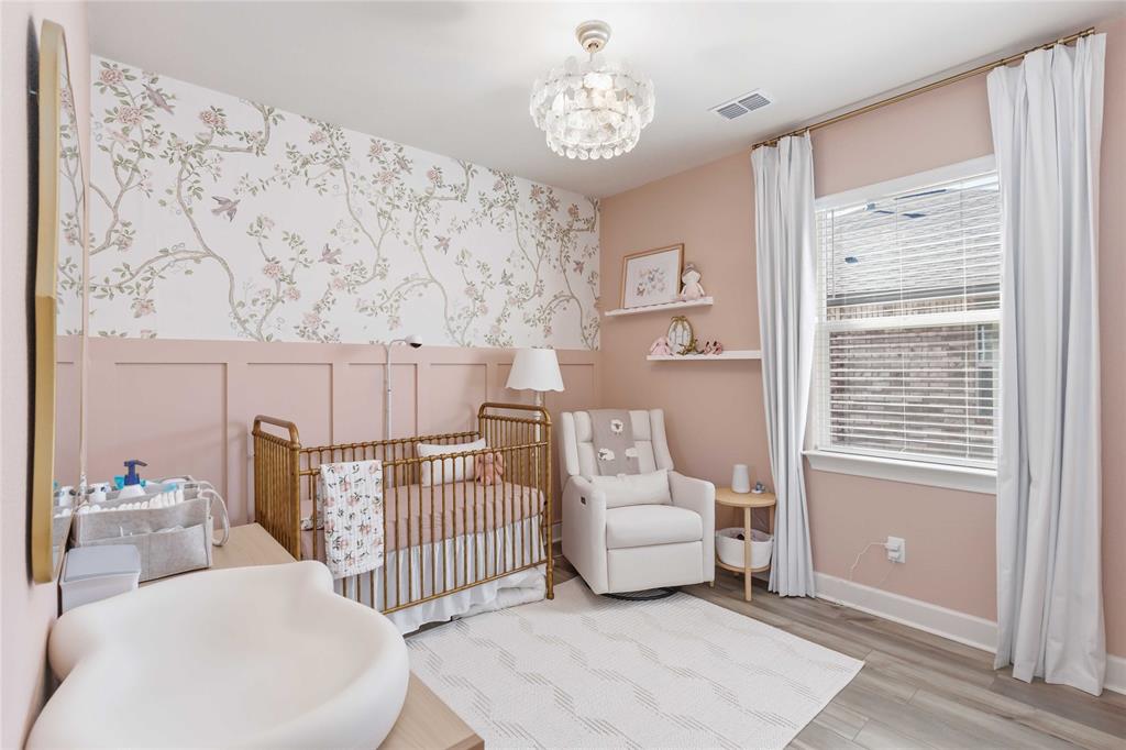 1012 Calhoun Drive Anna, TX 75409 - Photo 25 of 39 Bedroom updated with new flooring, wainscoting and chandelier