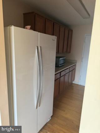 1121 University Boulevard West, Unit 1312 Silver Spring, MD 20902 - Photo 9 of 17 Modern kitchen with ample storage.