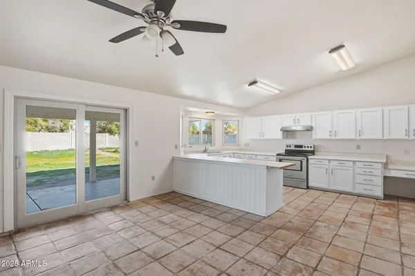 a kitchen with a refrigerator a sink and dishwasher