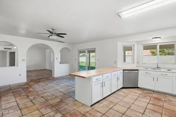 a view of living room with granite countertop furniture and fireplace
