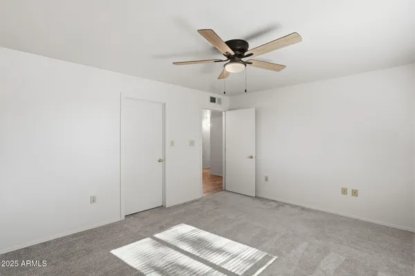 a view of a big room with carpet