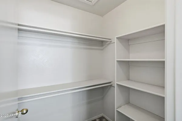 a view of an empty walk in closet