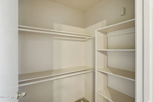 a view of an empty walk in closet