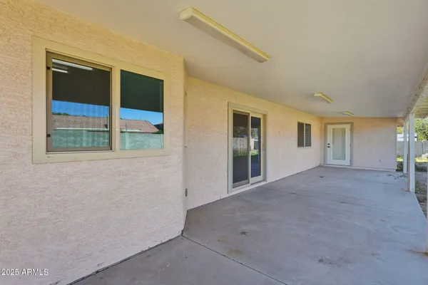 a view of an empty room with a window