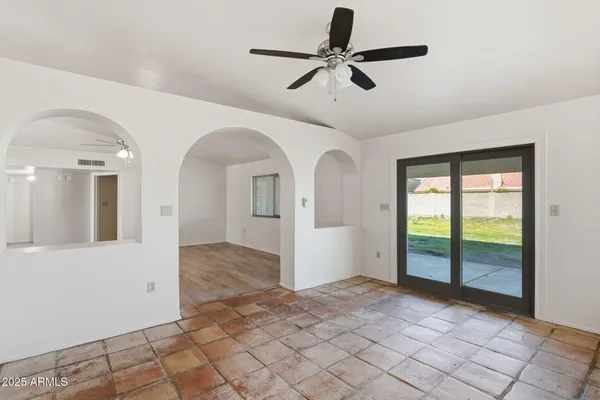 a view of livingroom with hardwood floor and ceiling fan
