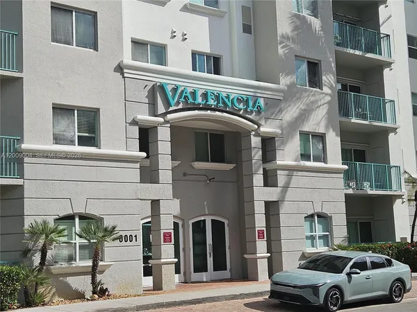 a view of a car parked in front of a building