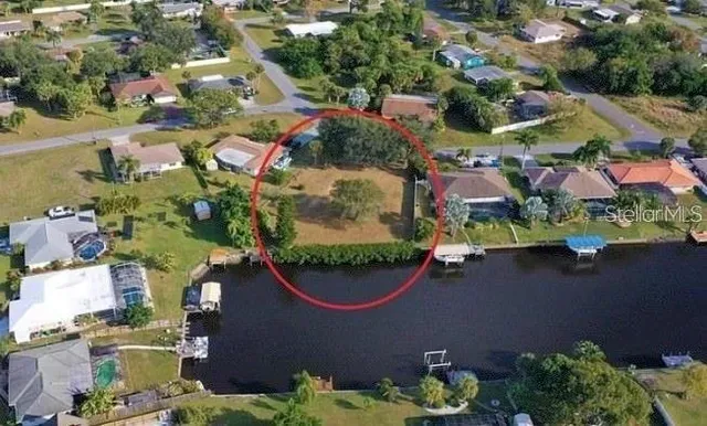 an aerial view of residential house with outdoor space and swimming pool