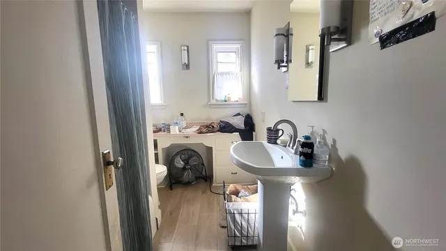 a bathroom with a sink and a mirror