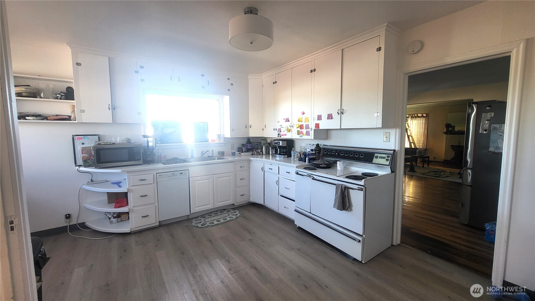 202 South 4th Street Odessa, WA 99159 - Photo 5 of 23 a kitchen with granite countertop white cabinets and white appliances