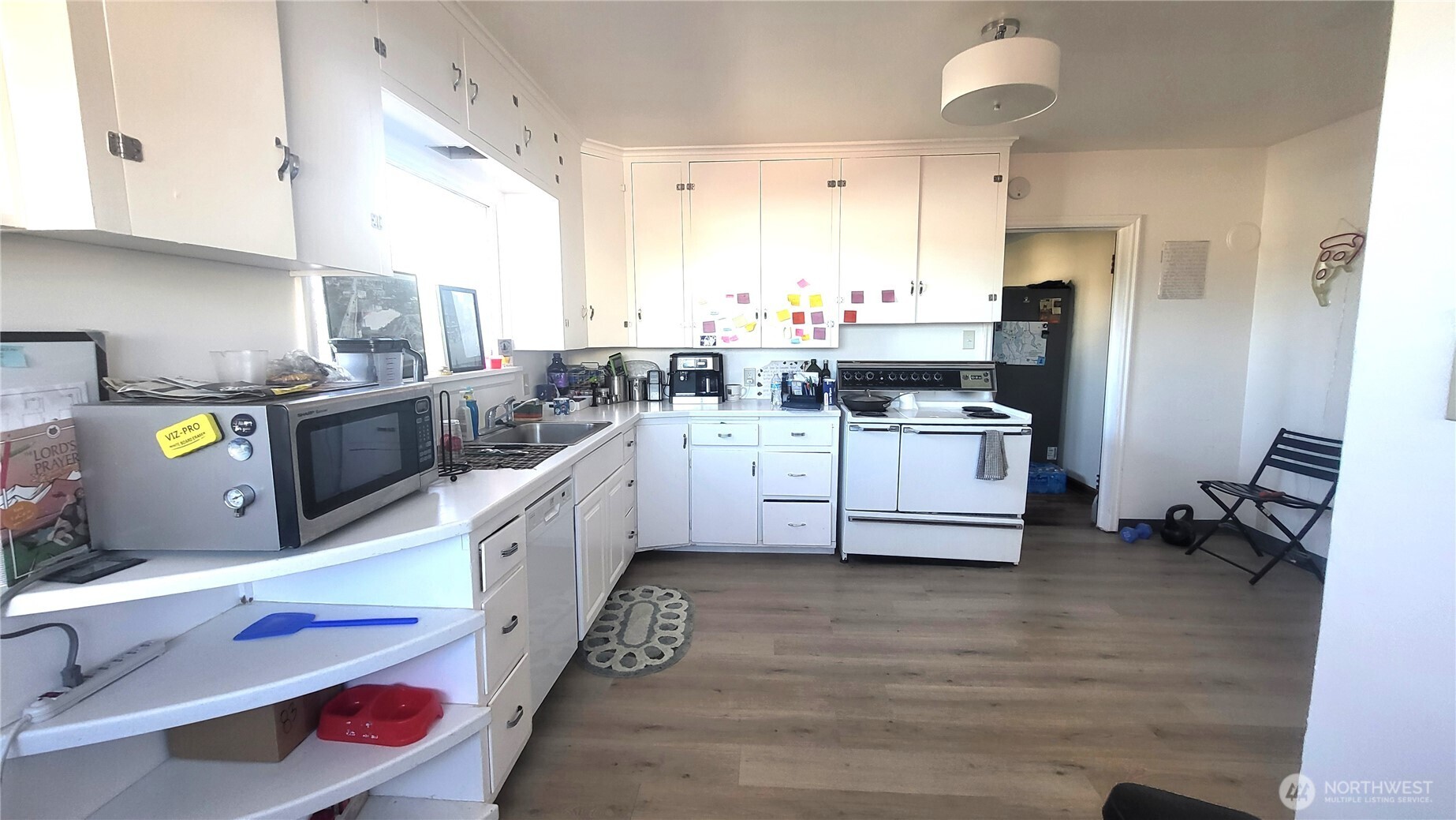 202 South 4th Street Odessa, WA 99159 - Photo 6 of 23 a kitchen with stainless steel appliances a sink a stove a refrigerator cabinets and a counter space