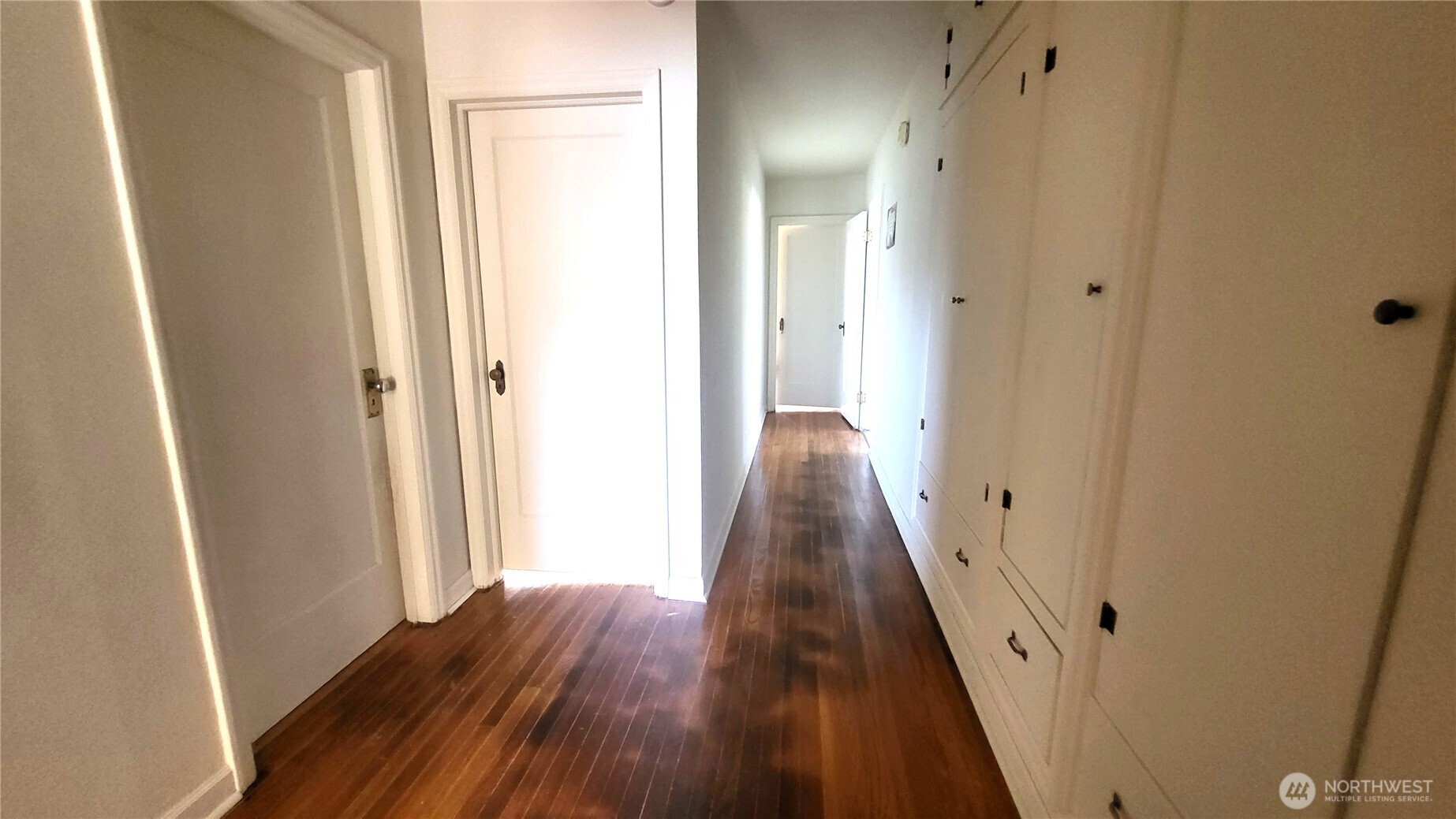 202 South 4th Street Odessa, WA 99159 - Photo 7 of 23 a view of a hallway with wooden floor and staircase