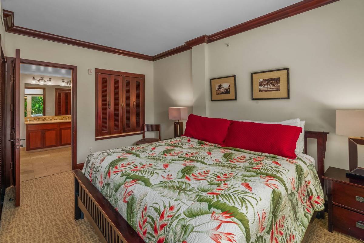 4-820 Kuhio Highway, Unit E103 Kapaa, HI 96746 - Photo 11 of 24 a bedroom with bed and a window