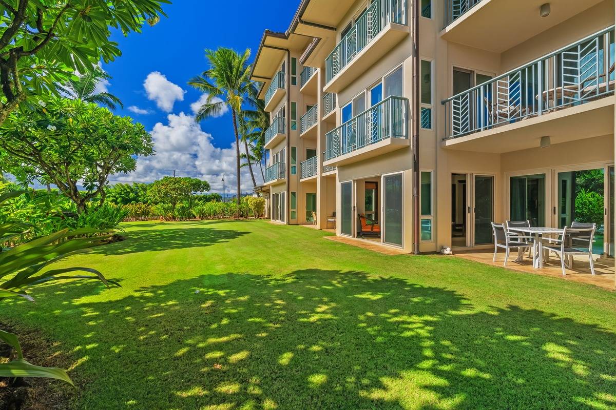 4-820 Kuhio Highway, Unit E103 Kapaa, HI 96746 - Photo 13 of 24 a view of a house with a yard