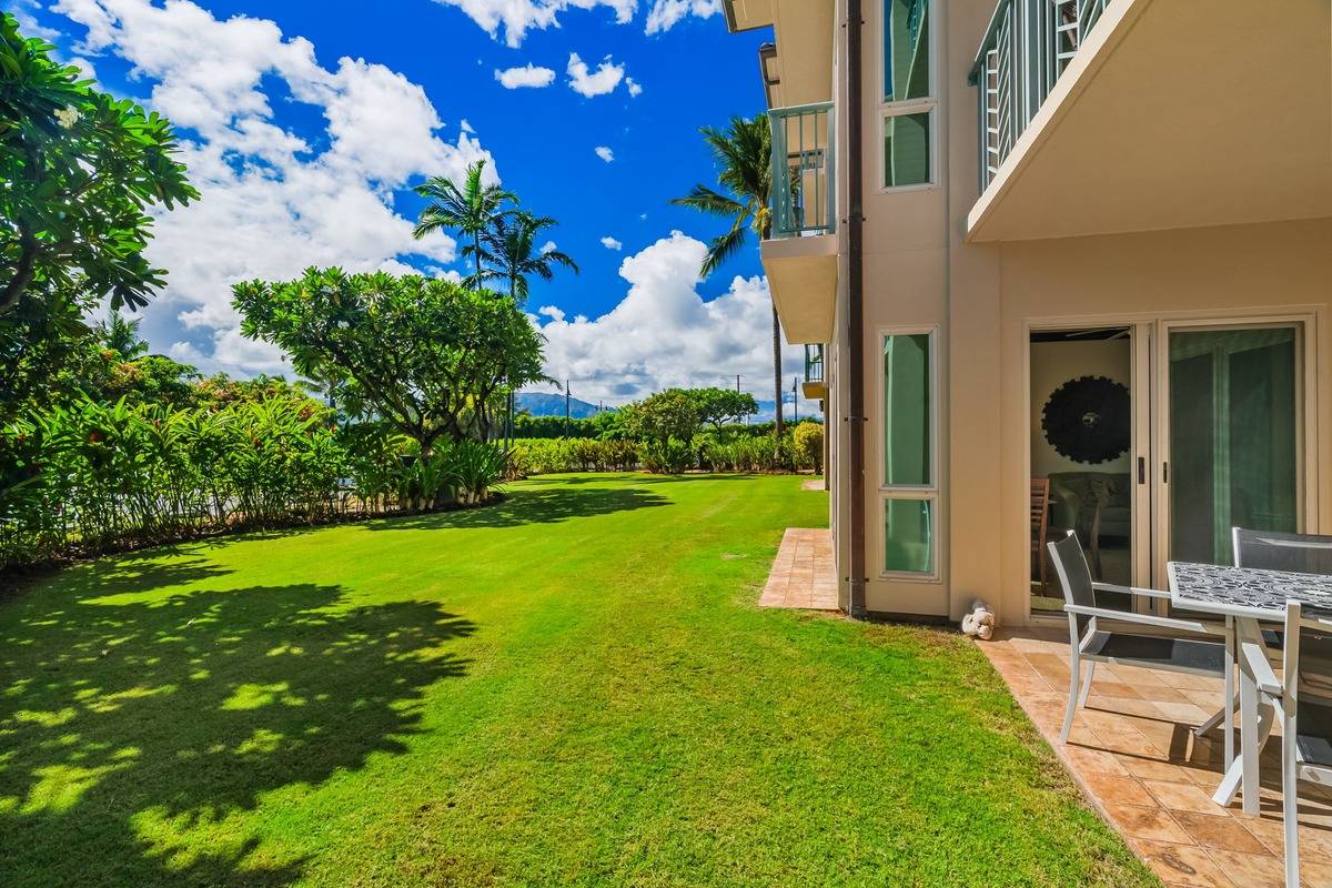 4-820 Kuhio Highway, Unit E103 Kapaa, HI 96746 - Photo 14 of 24 a view of a house with backyard porch and garden
