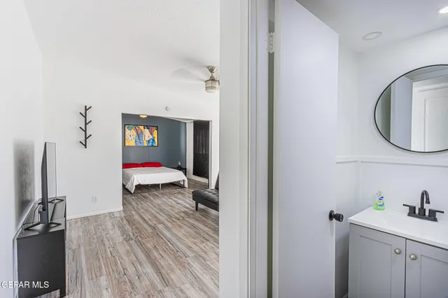a bathroom with a sink and a mirror