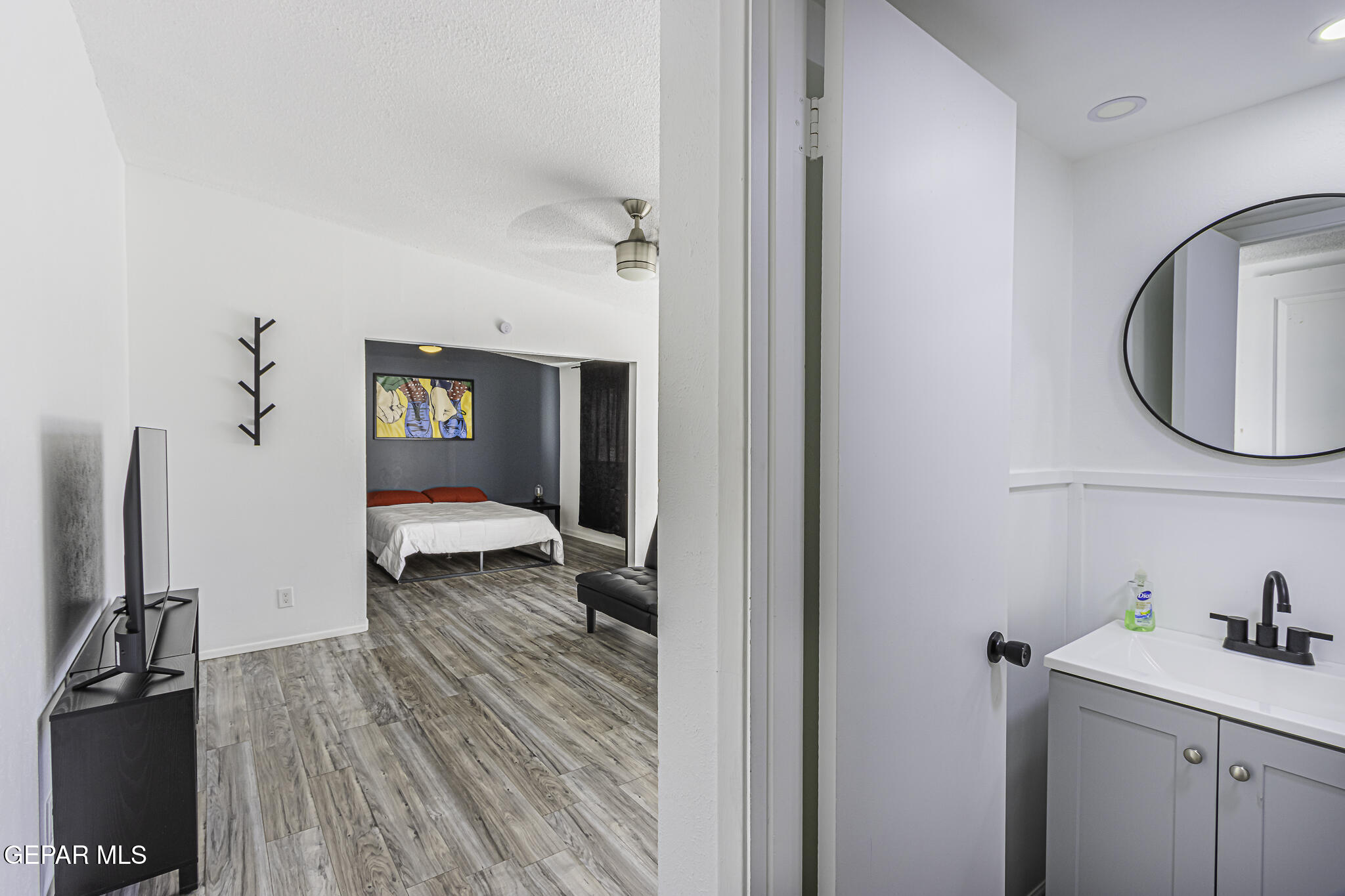 2425 Fir Street El Paso, TX 79925 - Photo 6 of 11 a bathroom with a sink and a mirror