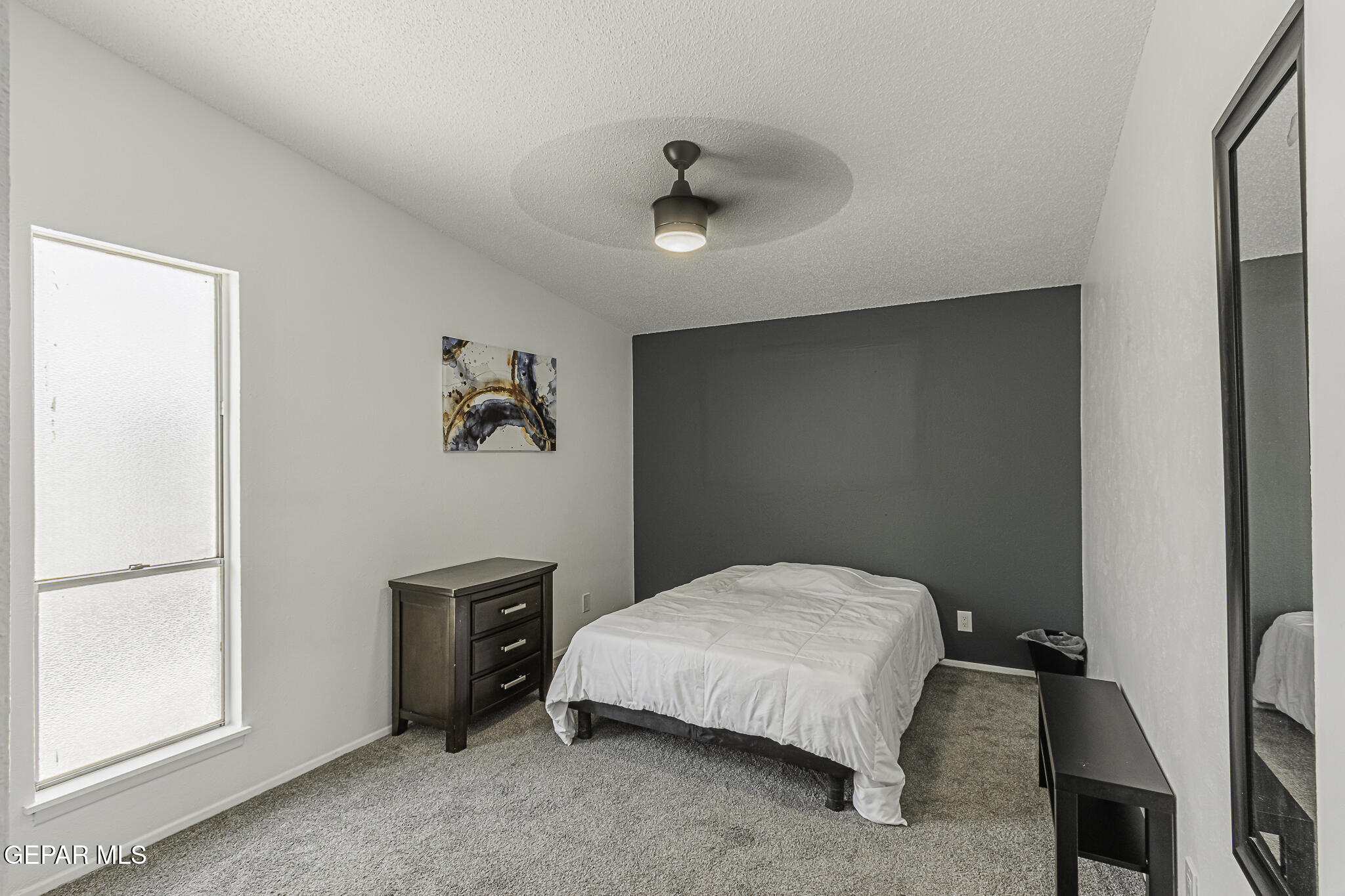 2425 Fir Street El Paso, TX 79925 - Photo 7 of 11 a bedroom with a bed and a window