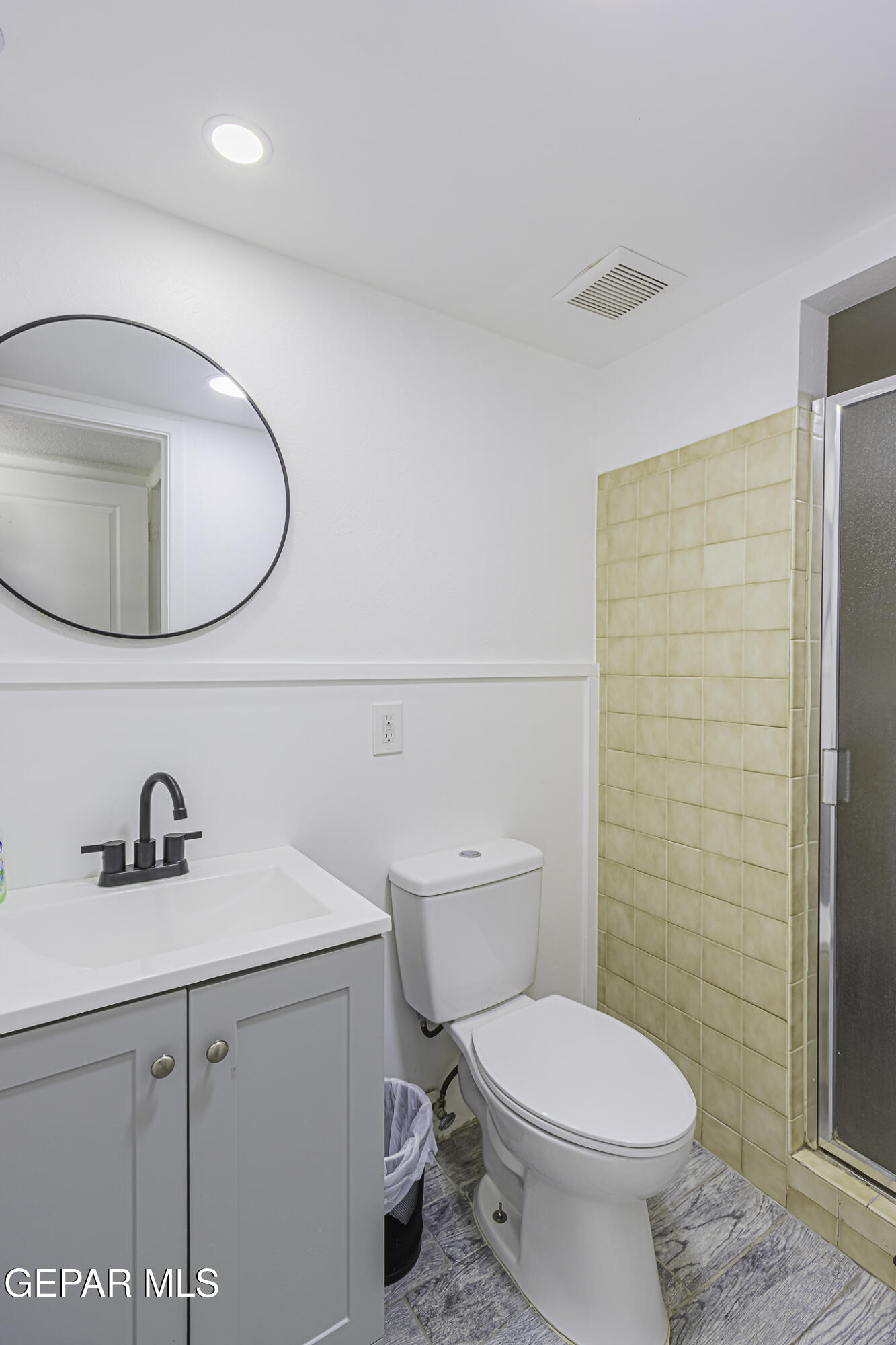 2425 Fir Street El Paso, TX 79925 - Photo 9 of 11 a bathroom with a sink a toilet and shower
