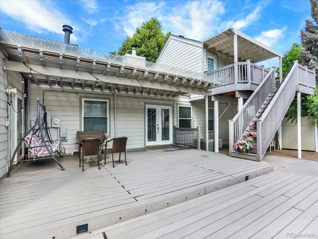 a view of a patio with chairs and tables