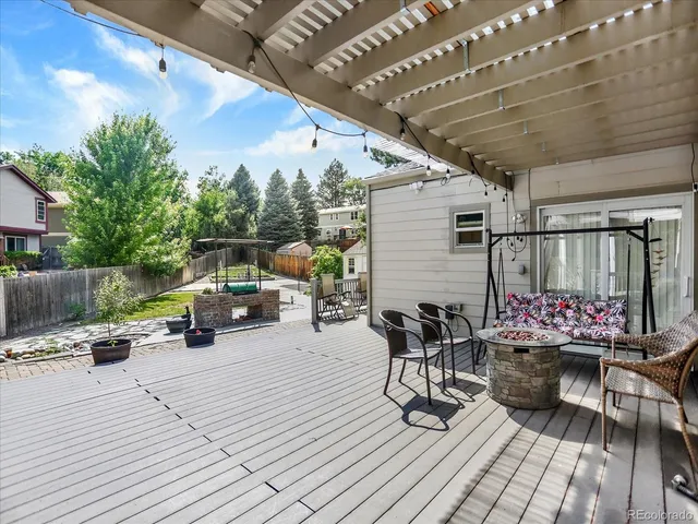 a view of a balcony with furniture