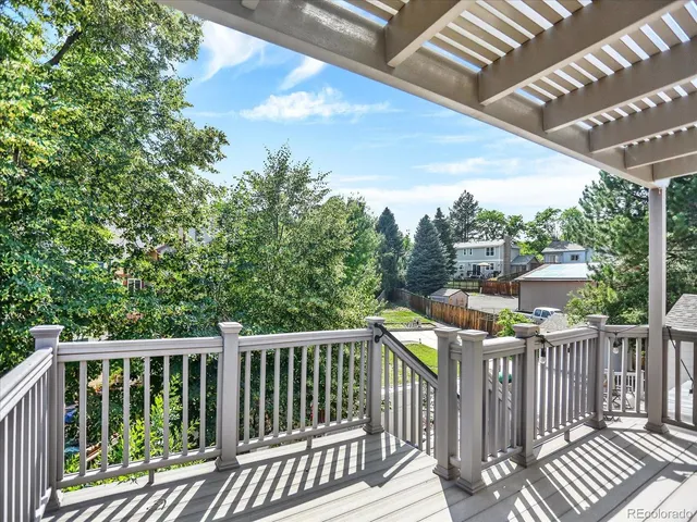 a house with green field in front of it